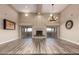 Spacious living room featuring high ceilings, a fireplace, and sliding glass doors to the backyard at 15155 E Westridge Dr, Fountain Hills, AZ 85268