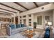 Spacious living room with a modern farmhouse style, exposed beams, and an open floor plan at 15155 E Westridge Dr, Fountain Hills, AZ 85268