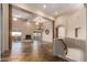 Open-concept living room featuring high ceilings, a fireplace, and stairs to other floors at 15155 E Westridge Dr, Fountain Hills, AZ 85268