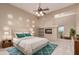 Tranquil bedroom featuring vaulted ceilings, fireplace, and a serene view at 15155 E Westridge Dr, Fountain Hills, AZ 85268