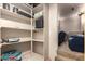 Finished basement storage area with shelving, projector, and seating at 15155 E Westridge Dr, Fountain Hills, AZ 85268