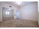 Bedroom with mirrored closet and access to hallway at 16068 W Edgemont Ave, Goodyear, AZ 85395