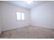 Simple bedroom with a window and ceiling fan at 16068 W Edgemont Ave, Goodyear, AZ 85395