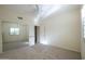 Bedroom features a mirrored closet, neutral carpet, and a ceiling fan for a serene living space at 16068 W Edgemont Ave, Goodyear, AZ 85395