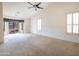 Spacious bedroom with large window and ceiling fan at 16068 W Edgemont Ave, Goodyear, AZ 85395