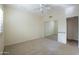 Comfortable bedroom with a mirrored closet, neutral carpet, and a ceiling fan for a relaxing retreat at 16068 W Edgemont Ave, Goodyear, AZ 85395