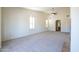 Inviting living room with ceiling fan, arched entry, and tiled fireplace, offering style and comfort at 16068 W Edgemont Ave, Goodyear, AZ 85395