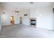 Living room with fireplace, access to bathroom and hallway at 16068 W Edgemont Ave, Goodyear, AZ 85395