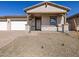 Charming single-story home with a two-car garage and desert landscaping at 17666 W Pierson St, Goodyear, AZ 85395