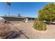 Home's back exterior, showing patio and trees at 18609 N Kiva Dr, Sun City, AZ 85373