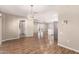 Bright dining area with wood-look floors and kitchen access at 18609 N Kiva Dr, Sun City, AZ 85373