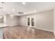 Spacious living room, featuring wood-look floors and french doors at 18609 N Kiva Dr, Sun City, AZ 85373