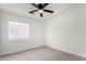 Cozy bedroom with window and ceiling fan at 22538 W Mohave St, Buckeye, AZ 85326