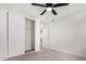 Simple bedroom with ceiling fan and closet at 22538 W Mohave St, Buckeye, AZ 85326