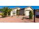 Cute curb appeal with a two-car garage and well-manicured yard at 22538 W Mohave St, Buckeye, AZ 85326