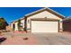 Newly built home with a two-car garage and desert landscaping at 22538 W Mohave St, Buckeye, AZ 85326