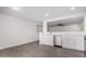 Modern kitchen with white shaker cabinets and stainless steel appliances at 22538 W Mohave St, Buckeye, AZ 85326