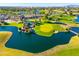 Aerial view of a golf course community with lakes and lush landscaping at 2257 W Periwinkle Way, Chandler, AZ 85248