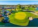 Aerial view of a pristine golf course and lake at 2257 W Periwinkle Way, Chandler, AZ 85248