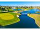 Aerial view of a beautiful golf course and lake at 2257 W Periwinkle Way, Chandler, AZ 85248