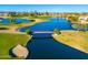 Aerial view of golf course with bridge and lake at 2257 W Periwinkle Way, Chandler, AZ 85248