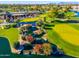 Aerial view showcasing the clubhouse and scenic golf course at 2257 W Periwinkle Way, Chandler, AZ 85248