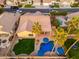 Aerial view of a house with a pool and spacious backyard at 2257 W Periwinkle Way, Chandler, AZ 85248