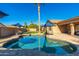 Inviting kidney-shaped pool with brick coping, surrounded by a spacious patio at 2257 W Periwinkle Way, Chandler, AZ 85248