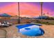 Inviting kidney-shaped pool with patio and lounge chairs; sunset view at 2257 W Periwinkle Way, Chandler, AZ 85248