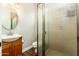 Clean bathroom with wood flooring, shower, and vanity at 2257 W Periwinkle Way, Chandler, AZ 85248