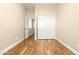 Well-lit bedroom with wood floors and double door closet at 2257 W Periwinkle Way, Chandler, AZ 85248