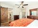 Main bedroom with barn door entry and an ensuite bathroom at 2257 W Periwinkle Way, Chandler, AZ 85248