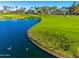 Ducks gather by the water's edge of a beautiful golf course at 2257 W Periwinkle Way, Chandler, AZ 85248