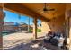 Relaxing covered patio with comfortable seating and views of the pool at 2257 W Periwinkle Way, Chandler, AZ 85248