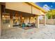 Covered patio with seating area and view into the kitchen at 2257 W Periwinkle Way, Chandler, AZ 85248