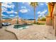 Inviting backyard with a kidney-shaped pool and patio at 2257 W Periwinkle Way, Chandler, AZ 85248