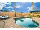 Inviting backyard with a kidney-shaped pool and patio at 2257 W Periwinkle Way, Chandler, AZ 85248