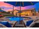 Enjoy cocktails by the pool on comfortable loungers at sunset at 2257 W Periwinkle Way, Chandler, AZ 85248