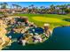 Multi-level waterfalls and ponds create a serene landscape feature at 2257 W Periwinkle Way, Chandler, AZ 85248