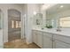 Double vanity bathroom with large mirror and walk-in shower at 2494 E Dulcinea Trl, Casa Grande, AZ 85194