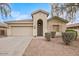 Front view of a single-story house with a two-car garage at 2494 E Dulcinea Trl, Casa Grande, AZ 85194