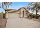 One-story house with a two-car garage and desert landscaping at 2494 E Dulcinea Trl, Casa Grande, AZ 85194