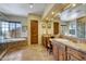 Elegant bathroom with double vanity and soaking tub at 27440 N Alma School Pkwy # 101, Scottsdale, AZ 85262