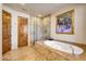 Primary bathroom with soaking tub and walk-in shower at 27440 N Alma School Pkwy # 101, Scottsdale, AZ 85262