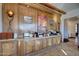 Breakfast bar with granite countertop and wood cabinets at 27440 N Alma School Pkwy # 101, Scottsdale, AZ 85262