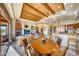 Open dining area with wood table and chairs, adjacent to kitchen and living room at 27440 N Alma School Pkwy # 101, Scottsdale, AZ 85262