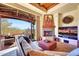 Relaxing living room with a fireplace and patio access at 27440 N Alma School Pkwy # 101, Scottsdale, AZ 85262