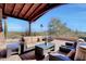 Covered patio with seating area and mountain views at 27440 N Alma School Pkwy # 101, Scottsdale, AZ 85262