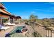 Luxury pool with lounge chairs and mountain views at 27440 N Alma School Pkwy # 101, Scottsdale, AZ 85262