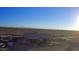 Aerial view showcasing a house, expansive desert landscape, and distant mountains at 30418 W Pierce St, Buckeye, AZ 85396